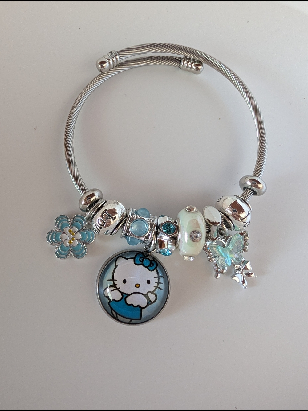 Hello Kitty Silver-Tone Charm Bangle Bracelet with Blue Accents for Kids